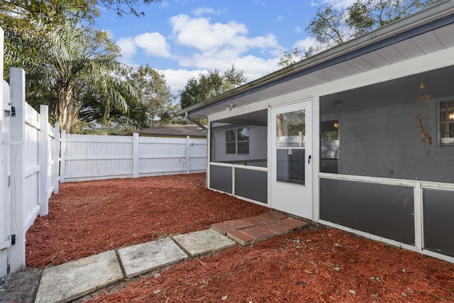 view of yard with a sunroom