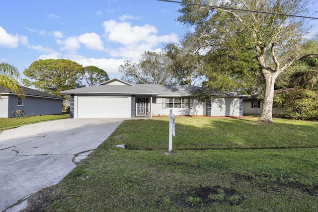 ranch-style home featuring a front lawn and a garage