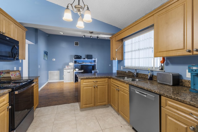 kitchen with black appliances, sink, hanging light fixtures, kitchen peninsula, and a chandelier