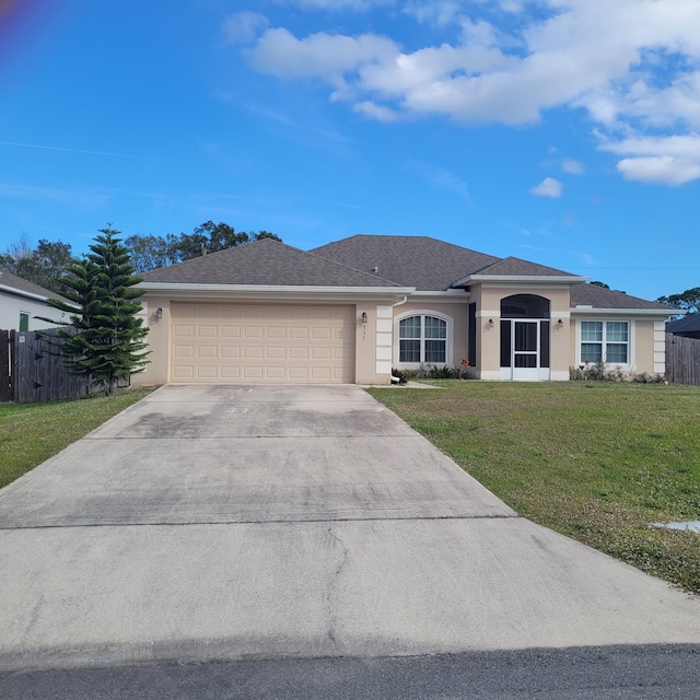 ranch-style home with a front yard and a garage