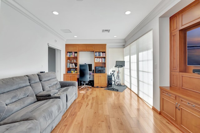 living room with ornamental molding and light hardwood / wood-style floors