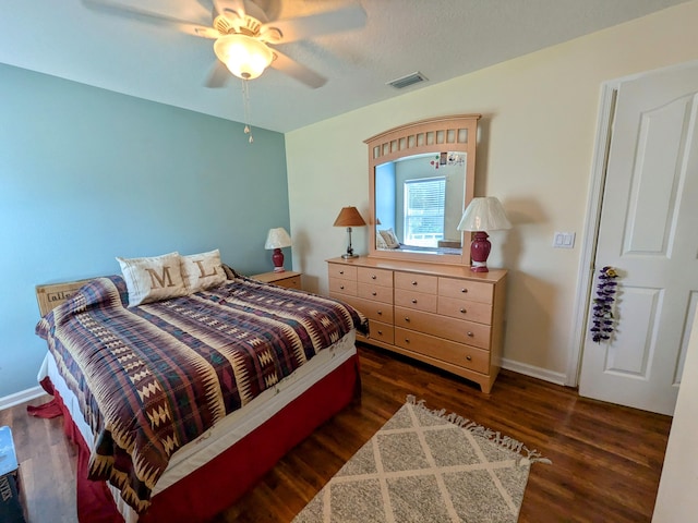 bedroom featuring dark wood-type flooring and ceiling fan