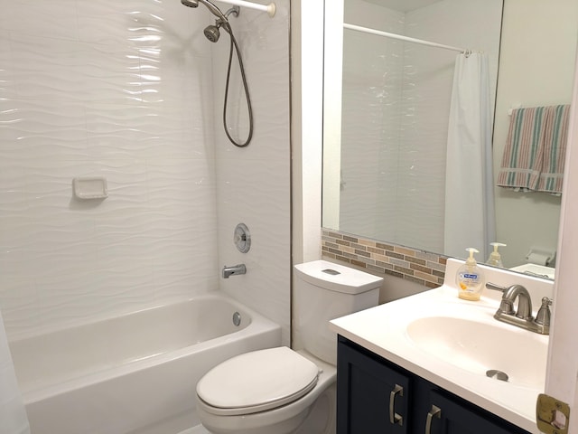 full bathroom featuring vanity, toilet, and shower / bathtub combination with curtain