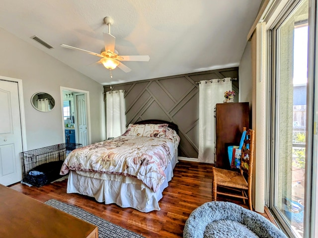 bedroom featuring ceiling fan, dark hardwood / wood-style floors, and vaulted ceiling