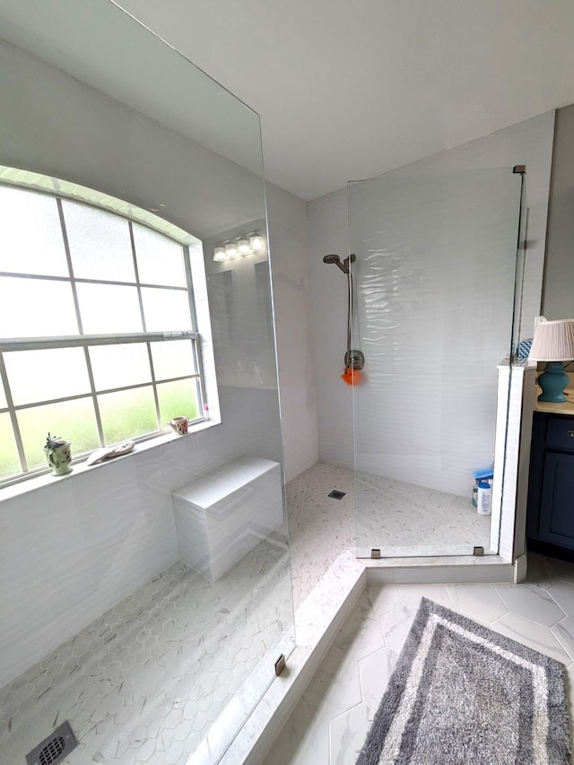 bathroom featuring tiled shower