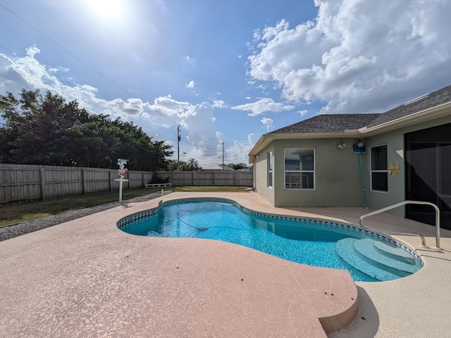 view of swimming pool featuring a patio area