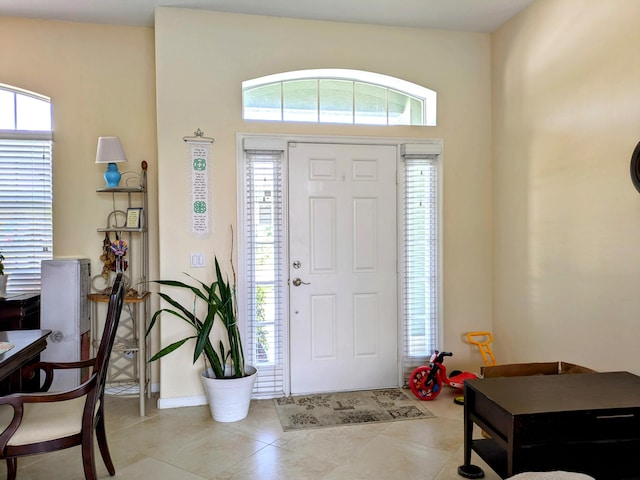 foyer entrance featuring light tile patterned floors