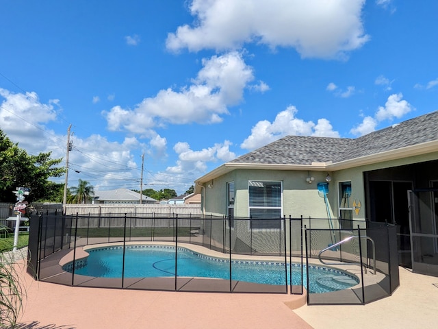 view of swimming pool with a patio area