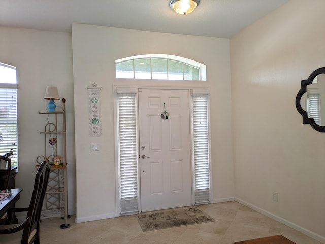 entryway featuring light tile patterned floors