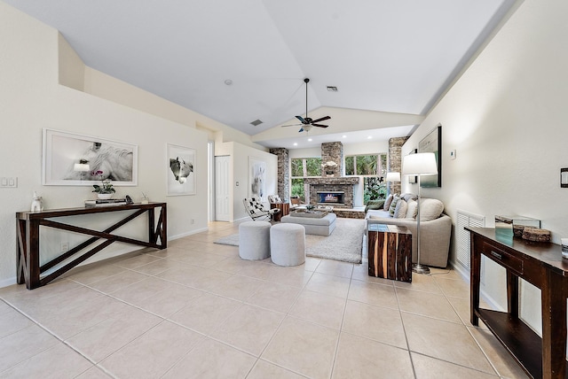 tiled living room featuring ceiling fan, a stone fireplace, and lofted ceiling