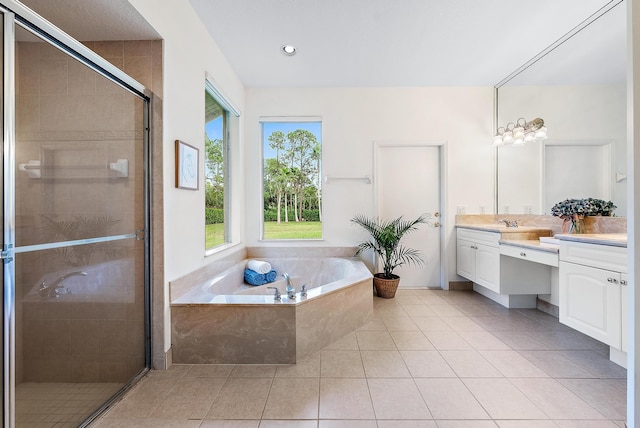 bathroom with tile patterned flooring, vanity, and independent shower and bath