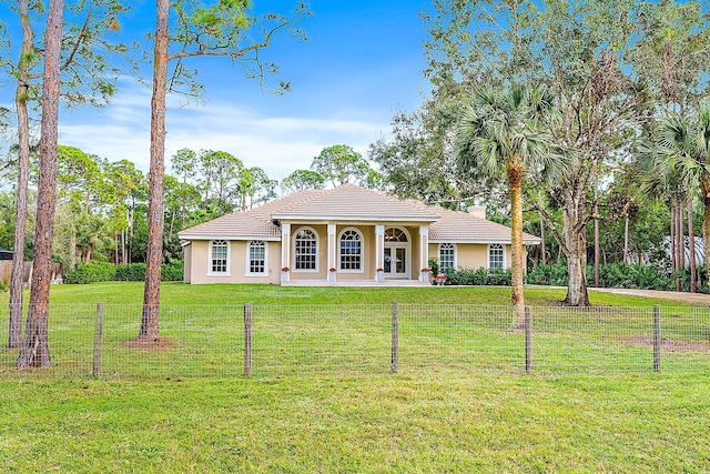 view of front of house with covered porch and a front lawn