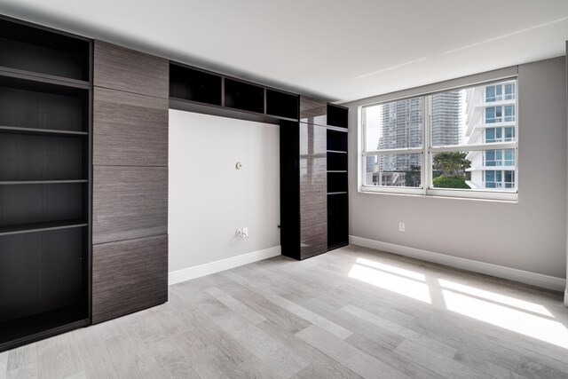 unfurnished bedroom with light hardwood / wood-style floors