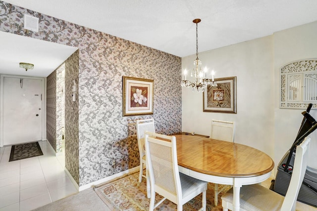 tiled dining room with a notable chandelier