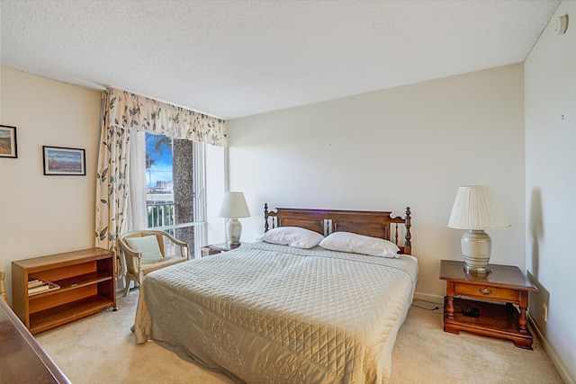 carpeted bedroom with a textured ceiling