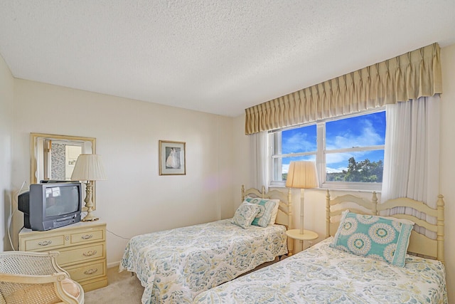 carpeted bedroom with a textured ceiling