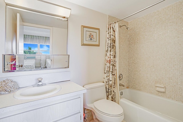 full bathroom with vanity, shower / bath combination with curtain, and toilet