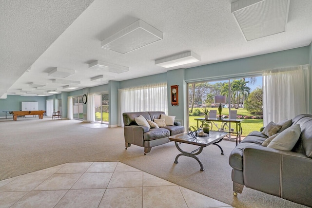 living room with light colored carpet and a textured ceiling