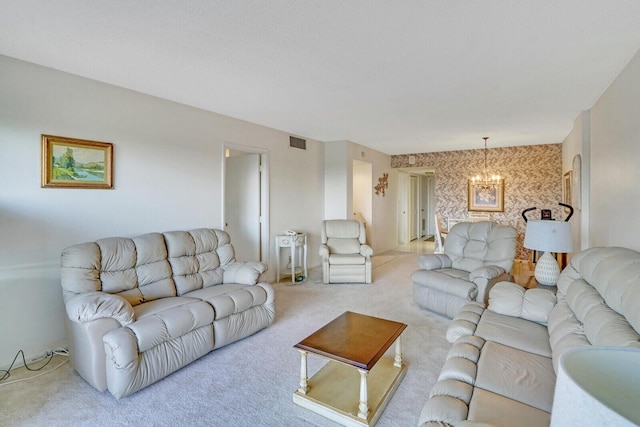 living room with light colored carpet and an inviting chandelier