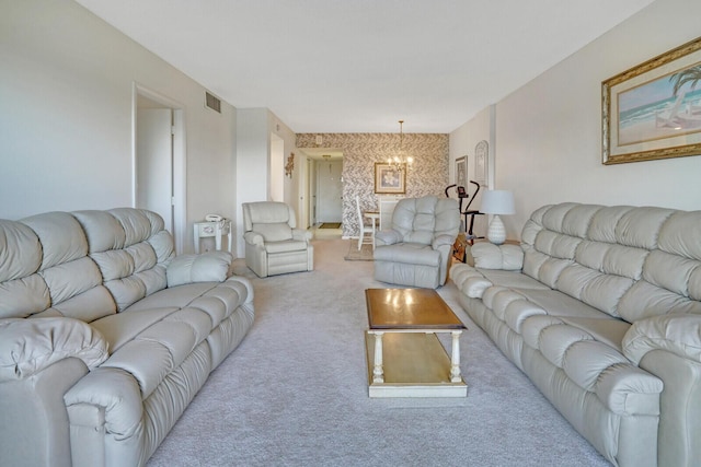 carpeted living room featuring a notable chandelier