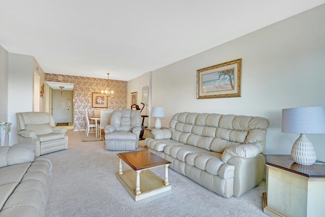 living room with carpet and a chandelier