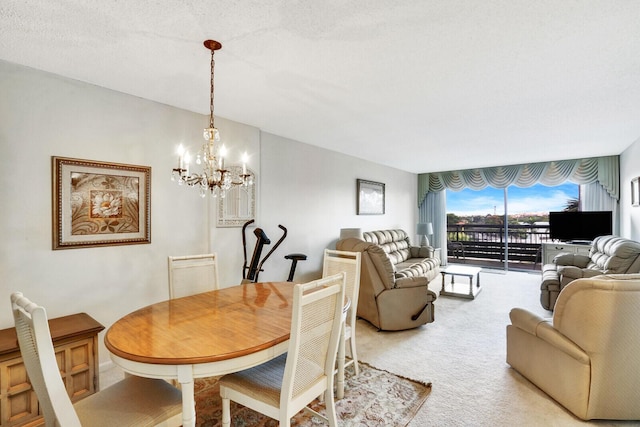 carpeted dining room featuring floor to ceiling windows, a chandelier, and a textured ceiling