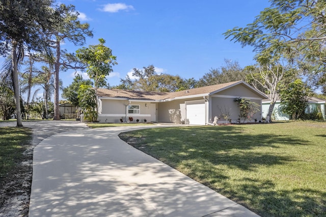 ranch-style house with a garage, concrete driveway, a front yard, and stucco siding