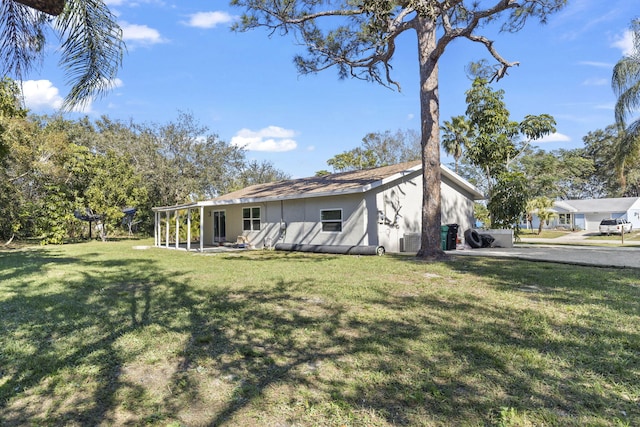 back of house with a yard