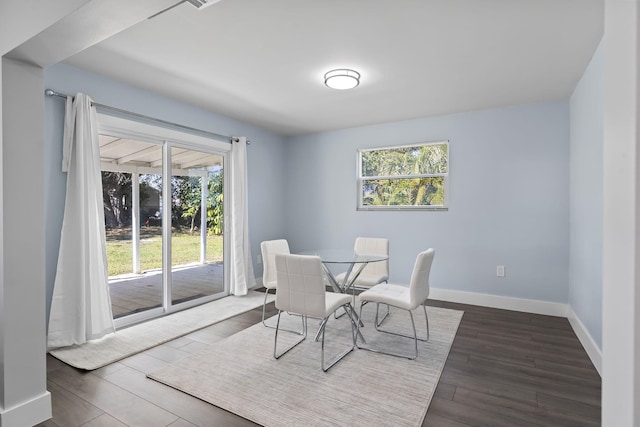 dining room with dark hardwood / wood-style floors