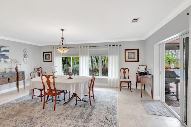 dining room with ornamental molding, visible vents, baseboards, and light tile patterned floors