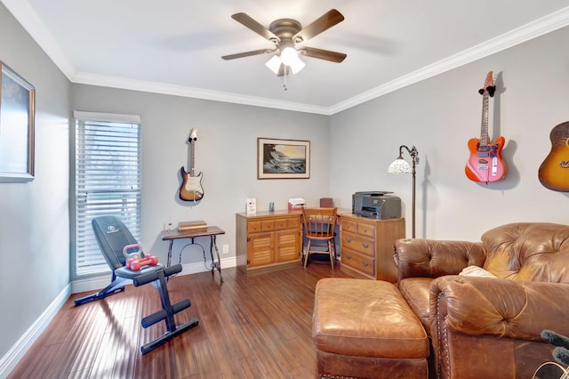 home office with dark wood-style floors, ornamental molding, baseboards, and a ceiling fan