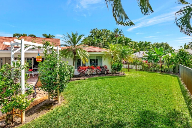 view of yard with a fenced backyard and a pergola