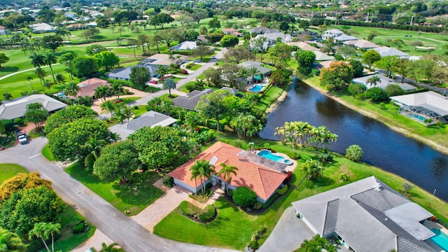 drone / aerial view featuring a residential view and a water view