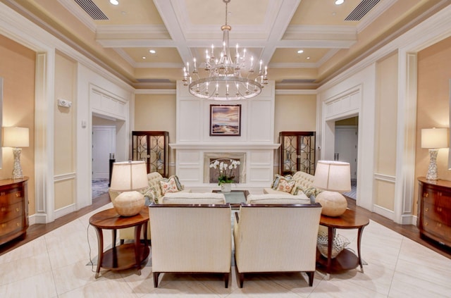 living area with an inviting chandelier, visible vents, coffered ceiling, and beam ceiling