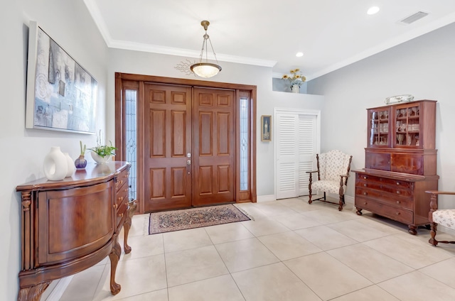 entrance foyer featuring light tile patterned floors, visible vents, baseboards, ornamental molding, and recessed lighting