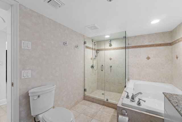 bathroom with tile patterned floors, shower with separate bathtub, and toilet