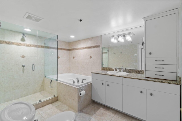 bathroom featuring tile patterned floors, vanity, shower with separate bathtub, and tile walls