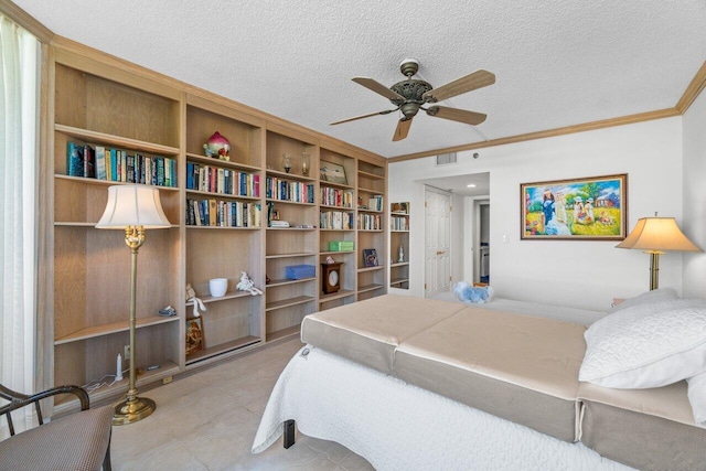 bedroom featuring ceiling fan, ornamental molding, and a textured ceiling