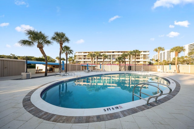 view of pool featuring a patio