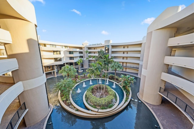 view of swimming pool featuring a water view