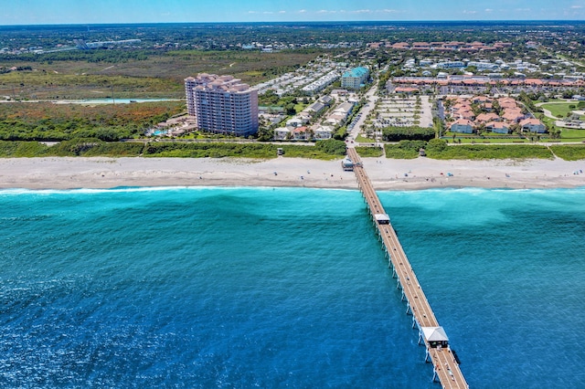 birds eye view of property featuring a water view and a view of the beach