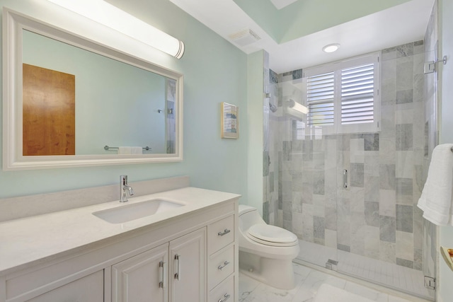 bathroom with vanity, an enclosed shower, and toilet