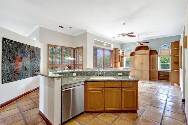 kitchen featuring stone counters, sink, a kitchen island with sink, stainless steel dishwasher, and crown molding