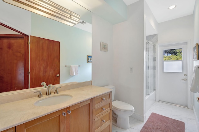 full bathroom with bath / shower combo with glass door, vanity, and toilet