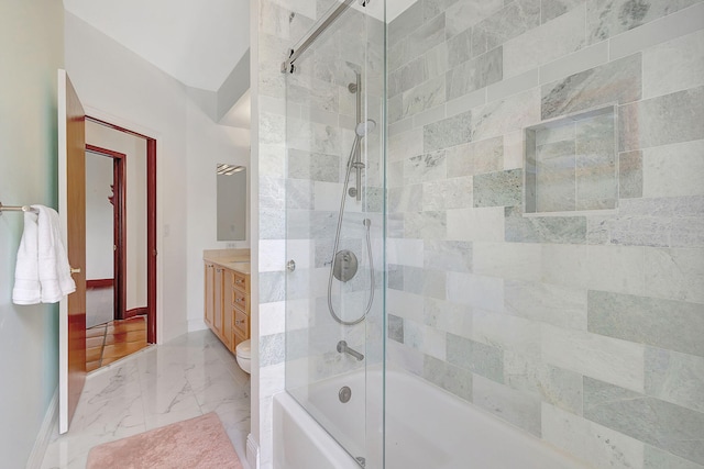 full bathroom with vanity, toilet, and combined bath / shower with glass door