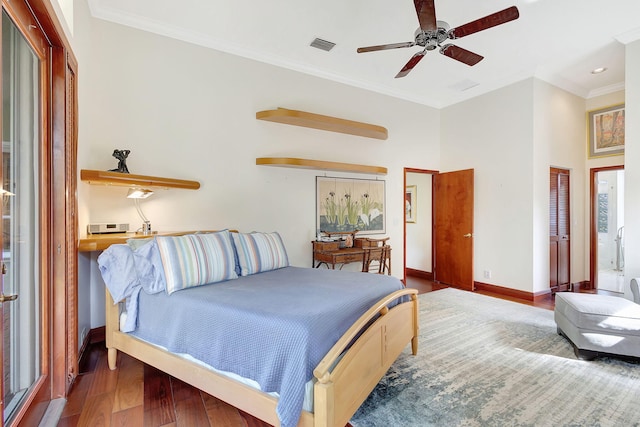 bedroom featuring crown molding and wood-type flooring