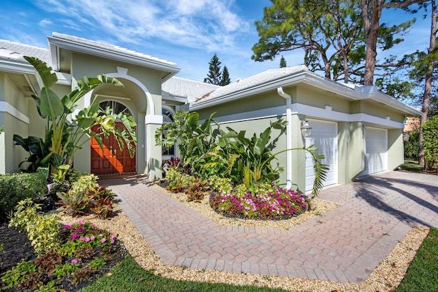 view of front of property with a garage