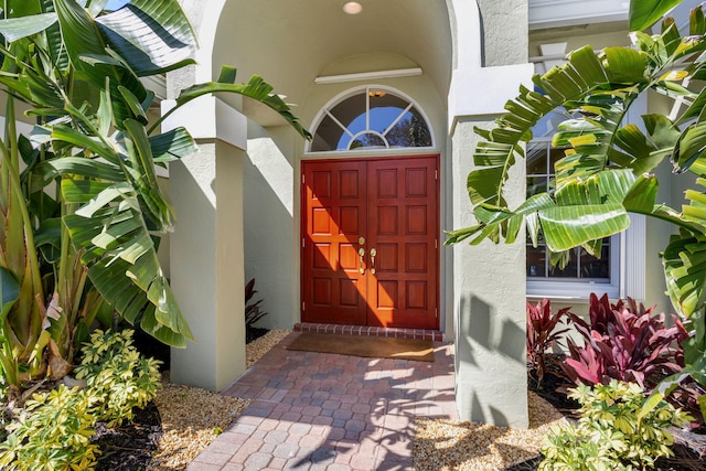 doorway to property with stucco siding