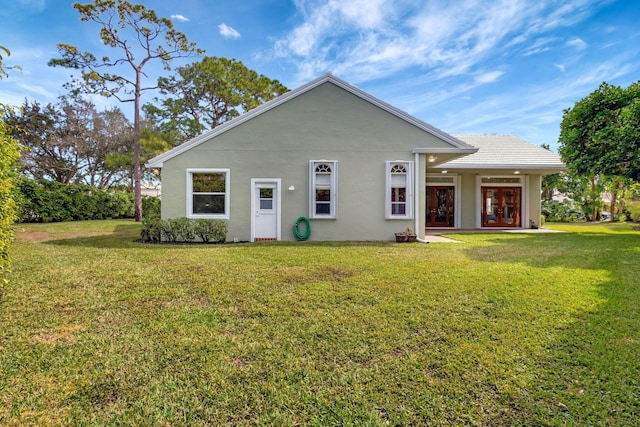 ranch-style home with a front lawn