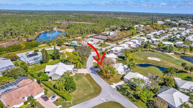 birds eye view of property with a water view